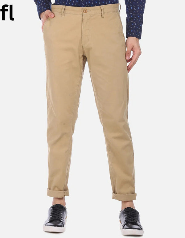 A pair of beige khaki cotton pants with a smart fit, displayed against a white background.